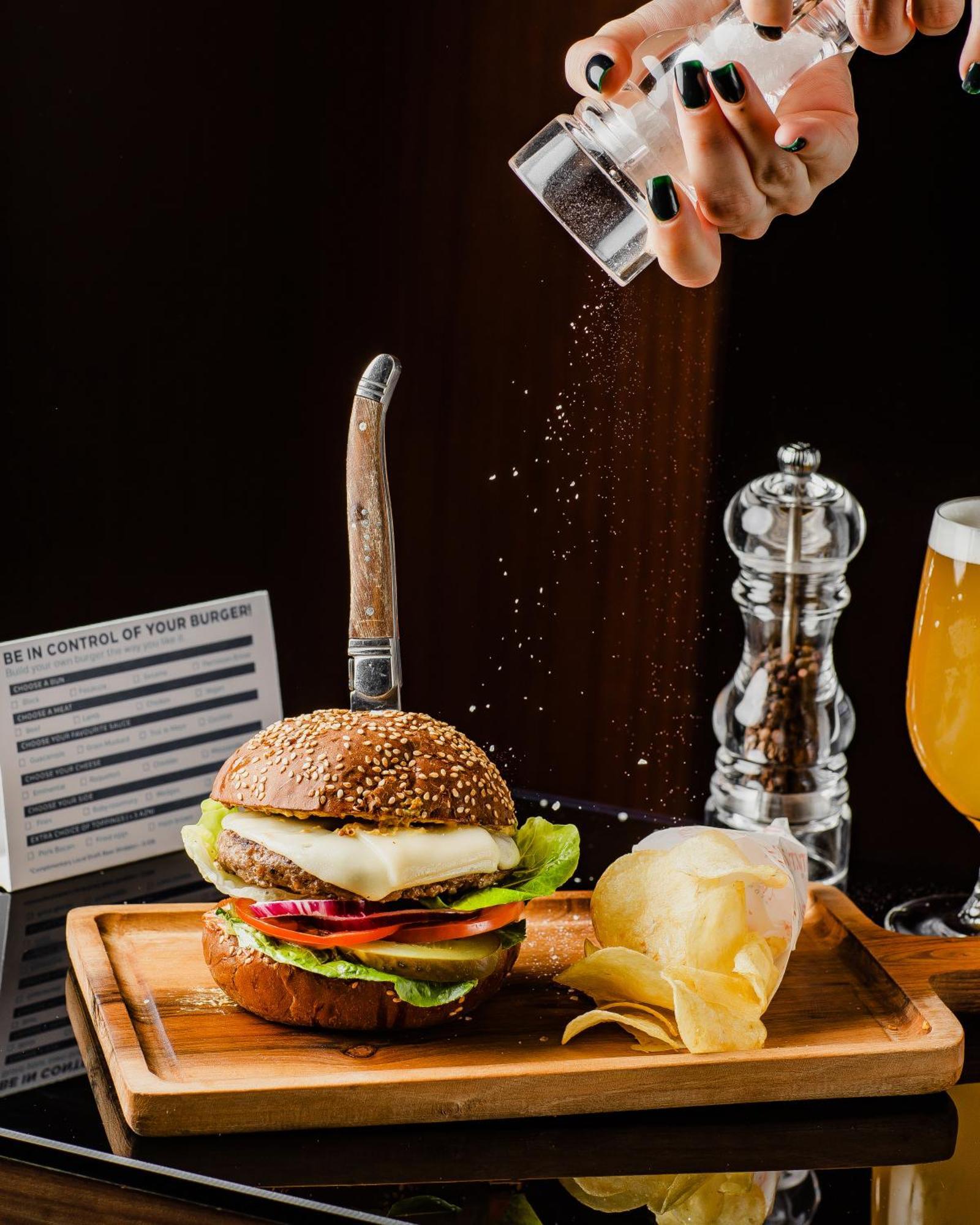 Hilton Baku Hotel Exterior photo A burger being seasoned with salt